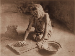 Plate 419: The Potter Mixing Clay