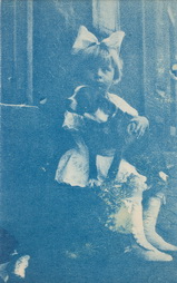 Seated Girl Holding Boston Terrier
